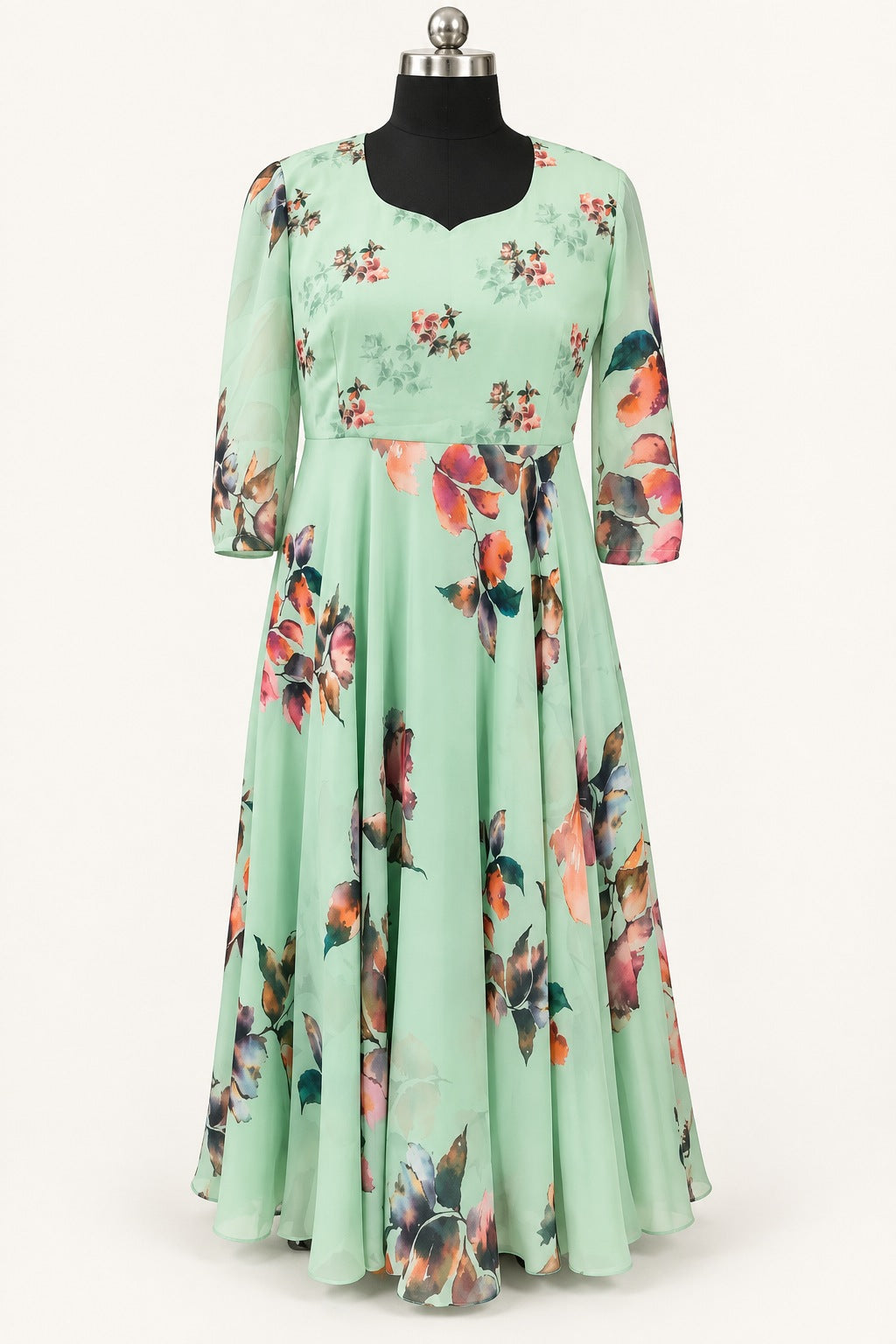 Background-retouched product photograph of the mint frock with floral bodice and large painterly blooms on the skirt
