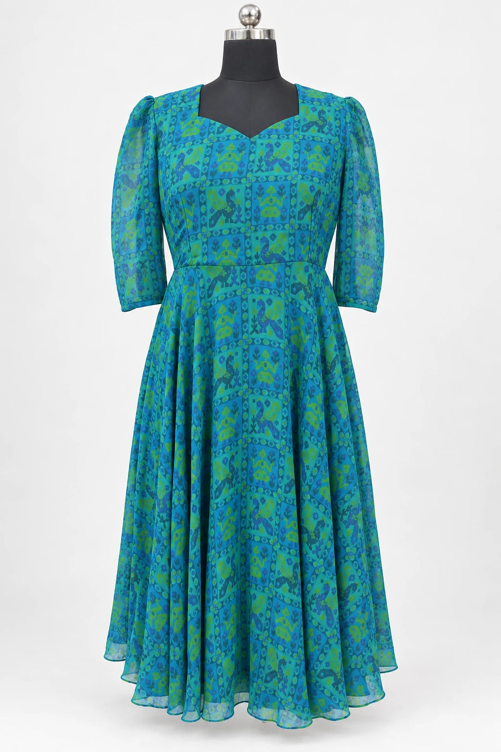 Rhea — Blue & Green Motif Dress, retouched garment front view on a clean background