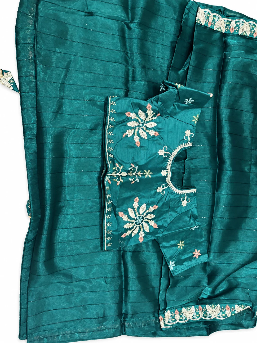 Mandira — Deep Teal Leaf Border Saree, retouched photographed blouse detail on a clean background