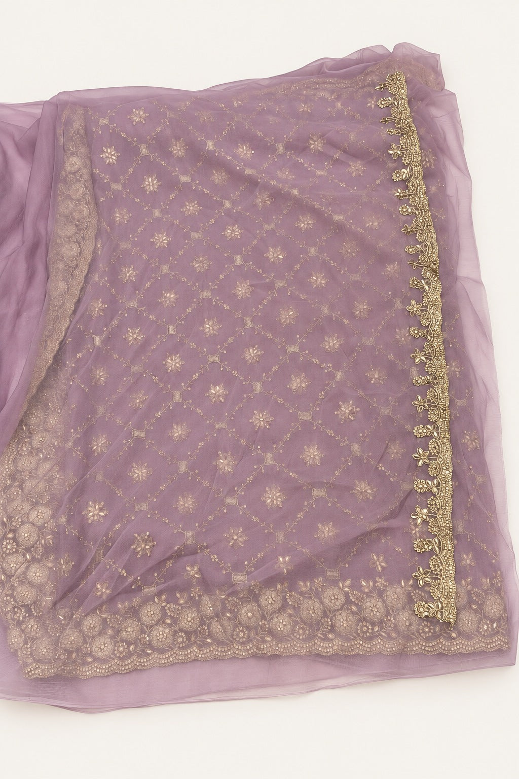 Background-retouched product photograph of the sheer-looking lavender pallu and narrow floral edging