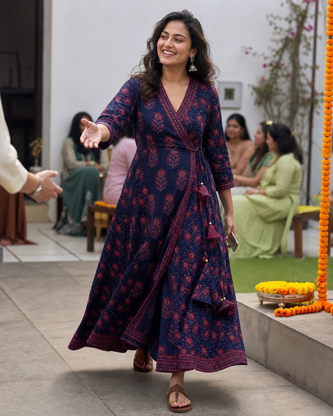 Indian wedding guest arriving at a daytime mehendi in an indigo and madder wrap dress